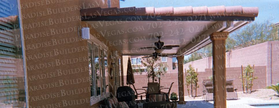 The Ultimate Patio Cover has a tile roof and finished ceiling with ceiling fans.