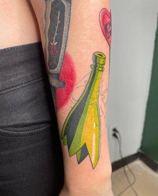 Broken glass bottle tattoo by Zoe.