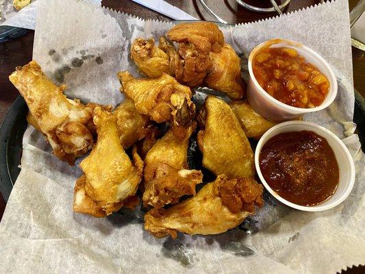 Wings with mango habanero sauce and spicy bbq sauce