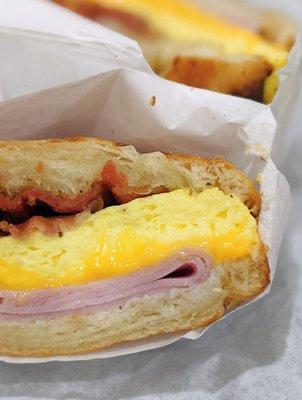 Breakfast croissant: bacon, ham, egg, cheese