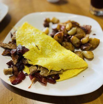 Bacon,Sausage and Cheddar omelette with potatoes