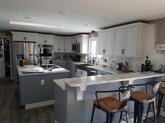 Epsom NH kitchen remodel, custom paint raise panel, island with cooktop, sink, trash pullout, pot filler, crown, dry bar, floor, quartz, etc