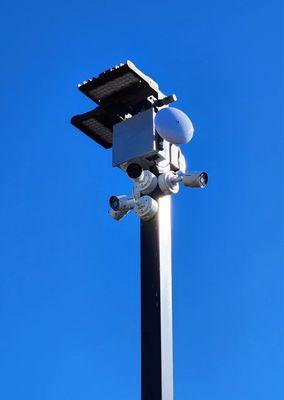 Video surveillance cameras connected to a wireless access point.