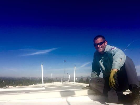 Versa-Tech® Founder Jason Baacke in Canoga Park, CA. Custom fabricated bird control for the roof of this retail center.