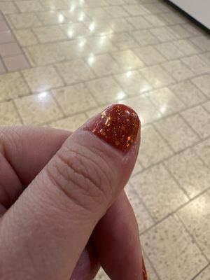 Orange base with sparkles gel nail