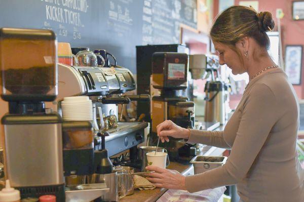 Our owner, Carol, making a delicious latte to go!