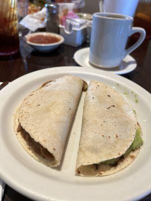 Carne Guisada and Guacamole Taco on Corn tortilla.