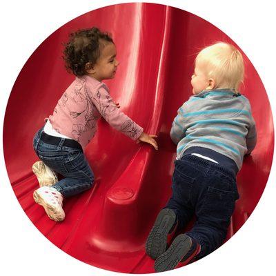 Simone and Toby use the slide together