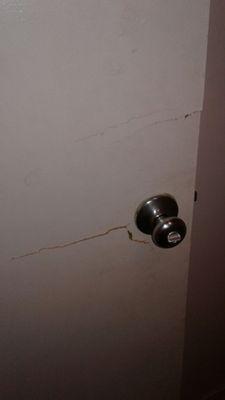 Cracks in the bathroom door. Door don't shut right