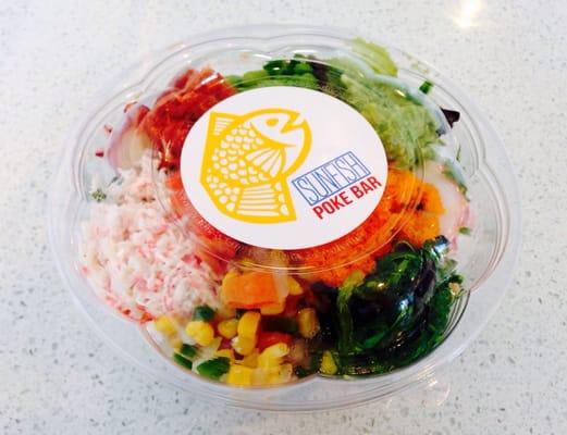 Poke bowl with half spring mix, half brown rice.