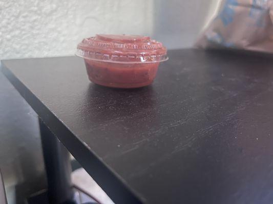 Spoiled salsa filled with gas.