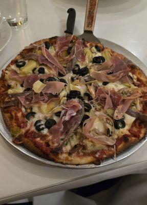 Quattro Stagioni pizza - Prosciutto di Parma, artichokes, mushrooms, olives, tomato sauce, mozzarella cheese, with added anchovies. Yum!