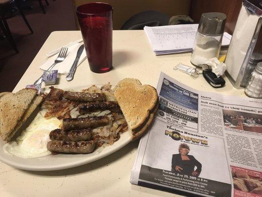 Sausage links and eggs over easy with hash browns and rye toast