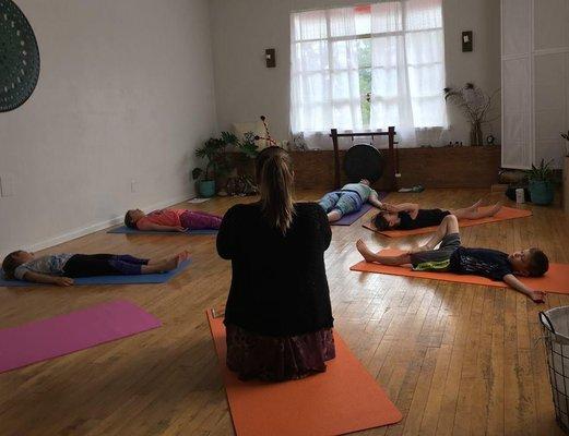 Shavasana during another traveling class.  You can come to us or we will come to you!