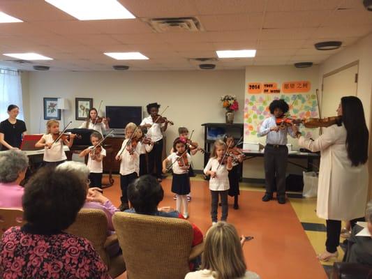 A traditional Suzuki Playdown for the residents at Grand St. Settlement!