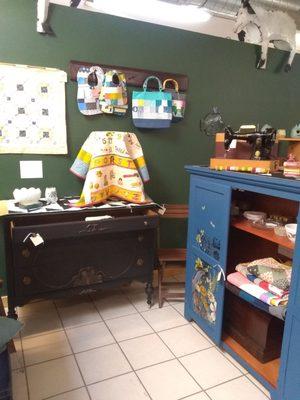 Quilt booth located upstairs in the steel goat marketplace