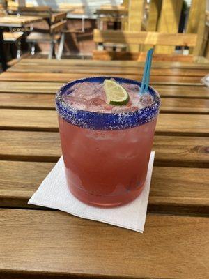 Strawberry margarita on the rocks with salt (also happy hour)