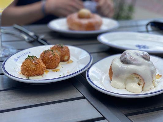 Arancini, cinnamon roll, and glazed donut