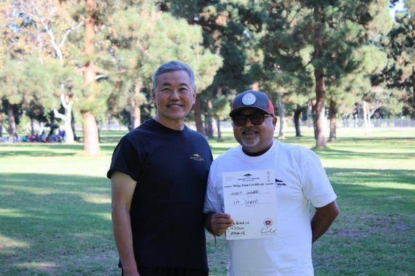 Coach Eric & Nish with his program one certificate