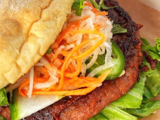 Beyond Mi Burger with pickled carrots and daikon, cucumbers, jalapenos, cilantro, lettuce, vegan aioli on a sesame bun $16.00