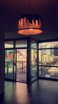 My awesome view from my open concept kitchen and living area on the 14th floor!check out that cool chandelier that came with it