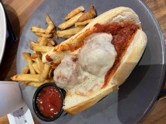 Meatball sandwich. French fries.