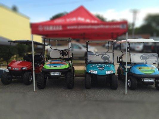 Customized golf carts on display.