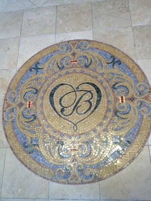 Cool floor mosaic with logo in it