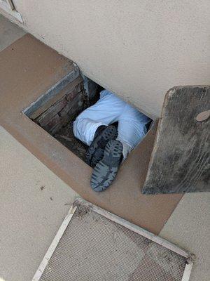 Jamie from At Home Inspections crawling under our new home.