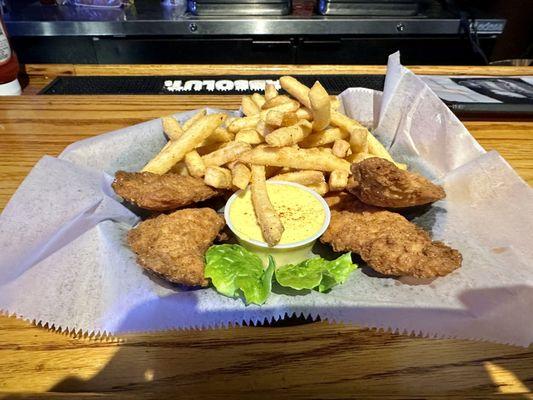 Chicken tenders with fries.