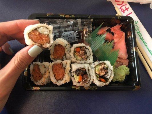 Spicy Tuna Roll and Salmon Skin Roll, respectively. Small and not rolled properly, messy. Salmon Skin tasted like cigarette smoke.