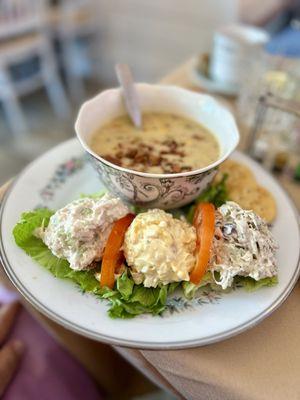 Trio of salads with a bowl of corn chowder