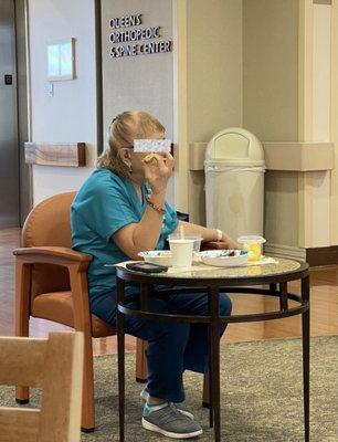 Staff eating in the visitors waiting area