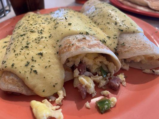 Savory crepes: egg, ham, onions and peppers inside, smothered in yummy hollandaise