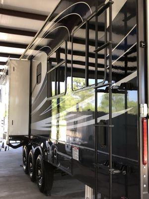 Exclusive wash+wax on a fifth wheel.