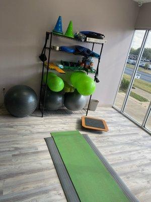 Various pieces of equipment used for floor exercises to improve flexibility, stride, and muscle development