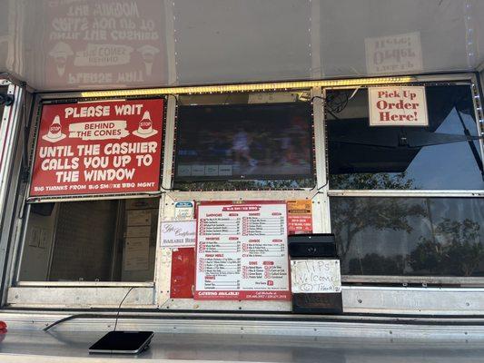 Order and pick up windows with a TV to watch football while waiting.