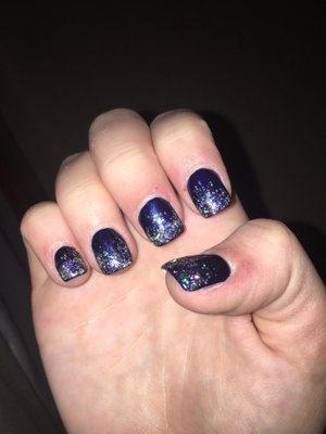 Navy acrylics with half glitter on each nail.