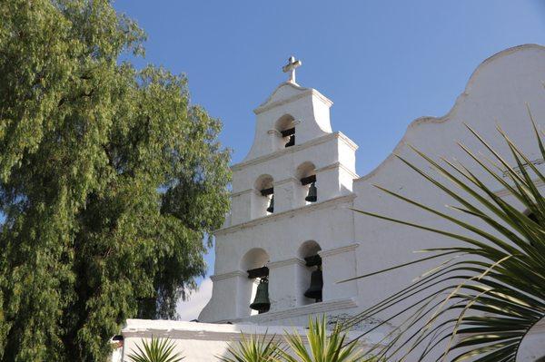 The bell tower, "campanarios" in Spanish, at the San Diego Mission is a striking and iconic feature of the building.