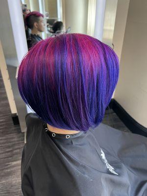 Purple and fuchsia hair color.