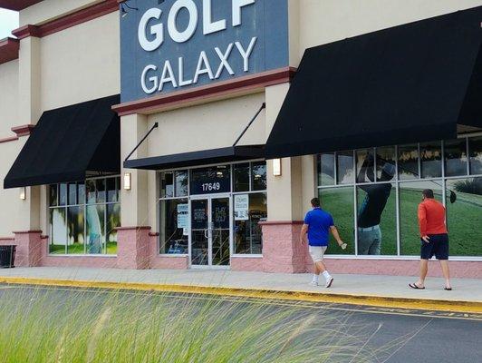 My guys skipping into the golf store!