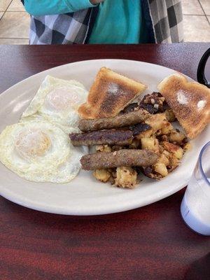 Two eggs, sausage, home, fries, and toast