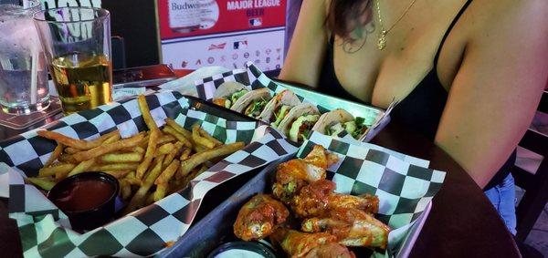 The best shrimp tacos in El Paso with fries and Lemon Pepper wings.