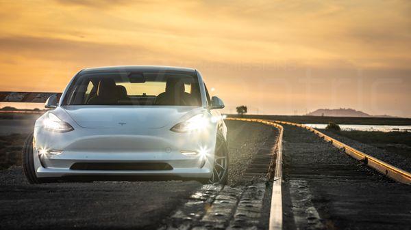 Model 3 on coilovers with 19" wheels enjoying the Alviso sunset.