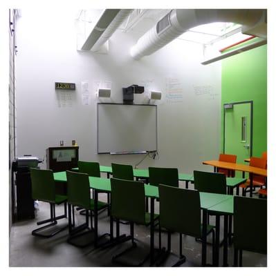 Every classroom is equipped with an interactive Smartboard and a write-on white wall.