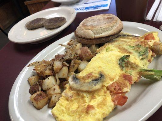 Veggie omelette with a perfectly cooked English muffin and home fries