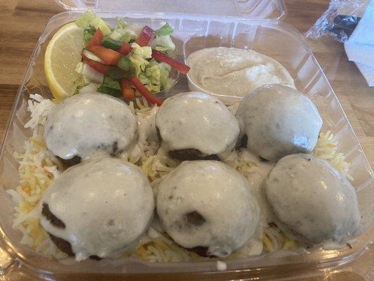 Falafel plate with salad, rice and hummus.