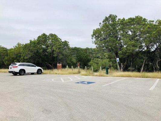 Parking area with marked space for about 12 cars.