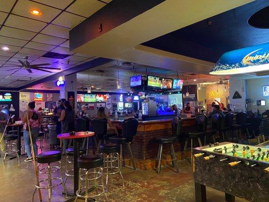 Shot of the bar area from nearby the pool tables