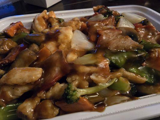 Triple Delight: chicken, pork, jumbo shrimp sautéed with veggies; special brown sauce